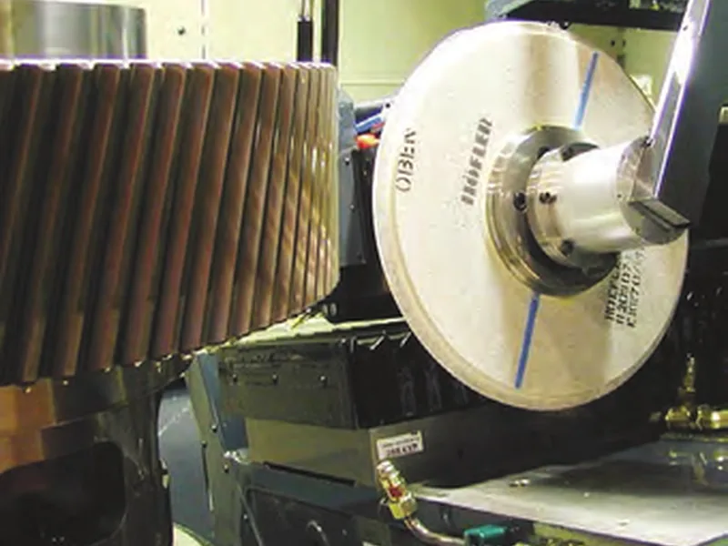 Grinding wheel finishing helical gear teeth on a CNC gear grinder at Raycar
