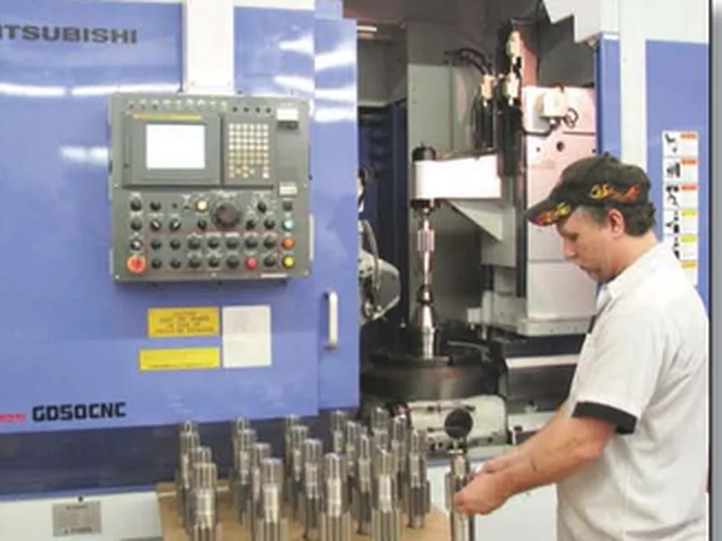 Raycar operator loading parts at the Mitsubishi GD50 CNC hobbing machine